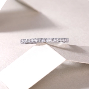Macro shot of silver S925 sterling silver ring with sparkling moissanite pavé stones