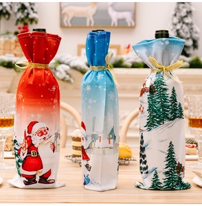 Detailed view of three festive wine bottle covers with Santa, Snowman and Pine patterns
