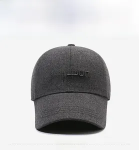 Detailed view of the titanium 3D embroidery and thick wool fabric on a gray baseball cap