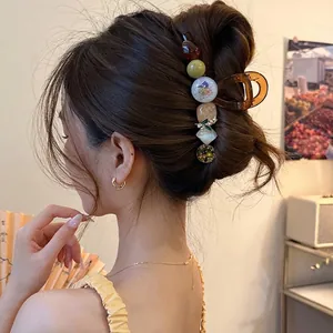 Pince à cheveux élégante avec motifs floraux pour coiffure chignon arrière pour femme