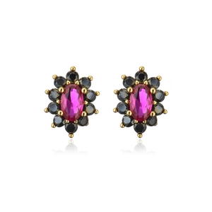 Close-up of 18K gold flower earrings featuring pink oval and black round zircon stones