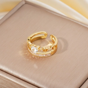 Macro shot of gold double-layer ring with micro-set zircons on soft silk fabric