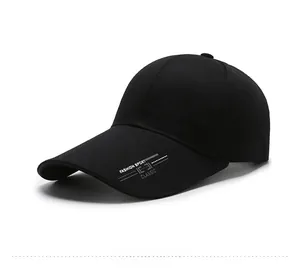 Detail of black cotton baseball cap with metal SPORT logo and classic brim text