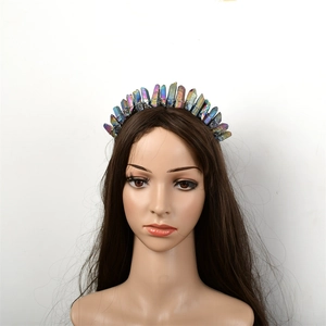 Close-up of handmade rainbow natural crystal quartz crown on a bridal headband