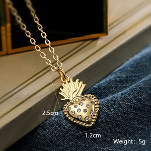 Detail showing 18K gold crown heart pendant dimensions 2.5cm by 1.2cm and weight 5g