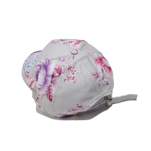 Detail view of the floral print baseball cap with adjustable metal back buckle closure