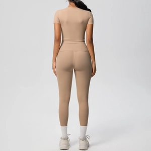 Rear view of light khaki breathable two-piece yoga set with slim fit tee and high waist leggings