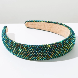 Macro shot of wide headband with sparkling AB rhinestones and brown velvet lining