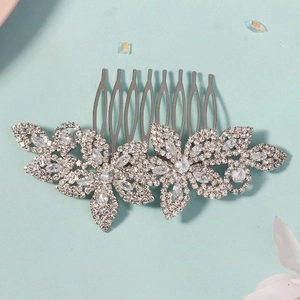 Close-up of sparkling silver flower hair comb with cubic zirconia for bridal party