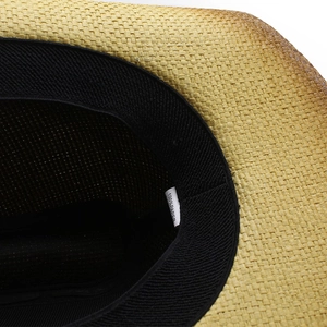 Western straw cowboy hat interior detail with 100% paper material label and sweatband