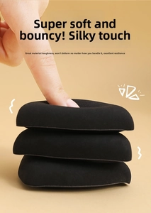 Detail showing the ultra-soft resilience and texture of a black flocked makeup puff