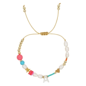Bohemian pearl bracelet with gold star, heart charms and initial A charm on white backdrop