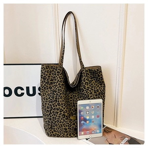 Leopard print canvas tote bag shown next to a tablet to demonstrate large capacity