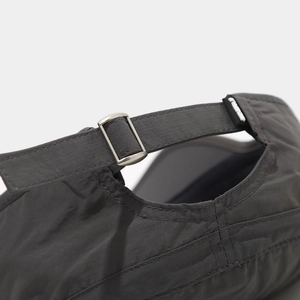 Detail of adjustable metal buckle and quick-dry nylon texture on dark grey cadet cap