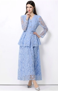 Detail of light blue floral lace two-piece set with V-neck top and maxi skirt
