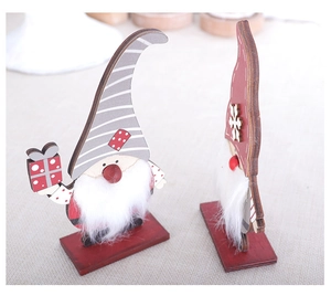 Detail of red and grey wooden Christmas gnomes with faux fur texture and hand-painted finish