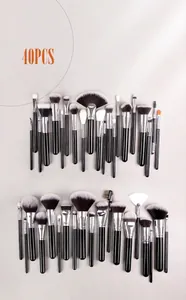 Close-up of 40-piece professional makeup brush set with silver ferrules and black handles