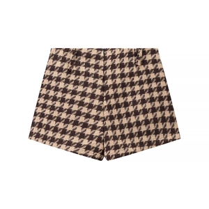 Detailed view of high-waisted houndstooth tweed shorts with premium textured fabric finish