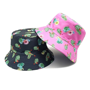 Reversible bucket hats featuring tropical cactus floral prints in black and pink colors
