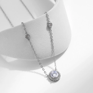 Elegant S925 sterling silver halo necklace with round zircon pendant on white background