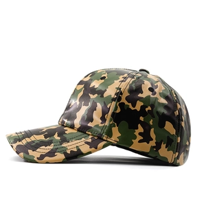 Detail of green camouflage PU leather baseball cap with glossy finish and six-panel crown