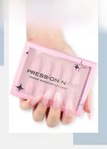 Close-up of almond-shaped press-on nails in light pink jelly finish with packaging box