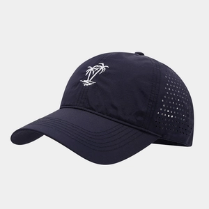 Detail view of navy blue mesh baseball cap featuring white palm tree embroidery and laser holes