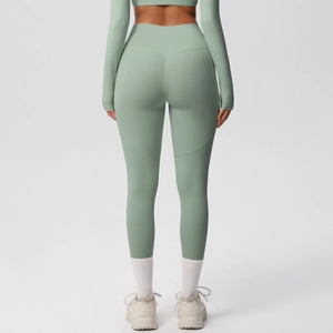 Detail showing high waist sage green yoga leggings with heart shaped booty lifting seam