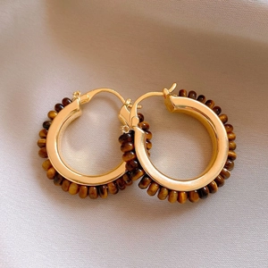 Retro 18k gold plated hoop earrings featuring brown tiger eye stones on pink fabric