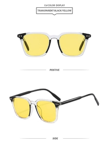 Detail of square frame sunglasses with yellow lenses and black white contrast finish