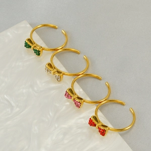 Adjustable gold bow rings set with colorful rhinestones in four vibrant colors