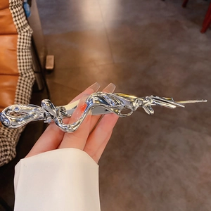 Silver liquid metal style butterfly hair clip with pearl accents for elegant hairstyles