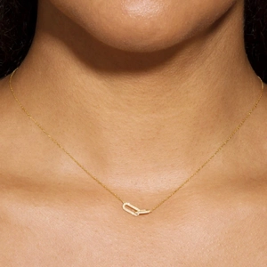 Close-up of golden S925 silver necklace with interlocking rings and sparkling pavé zircons