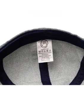 Macro shot of 100% cotton washing label and inner stitching on denim beret cap