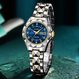Detail of blue diamond-set dial with dual calendar on gold and silver metal watch