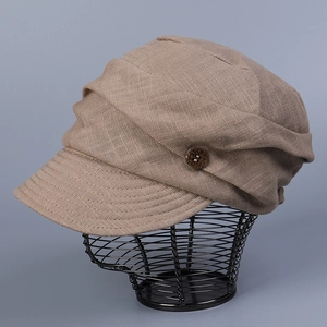 Detail of breathable linen cap fabric with side button and pleated texture design