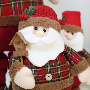 Plush Santa Claus figure with red plaid fabric and wooden birdhouse for Xmas decor