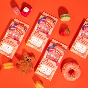 Adhesive press-on nails for kids featuring cute cartoon patterns and pink nail art designs