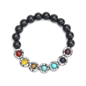 Detail of beaded yoga bracelet with black hematite and seven colorful chakra stones