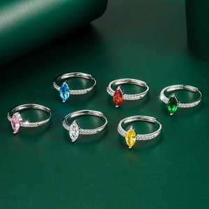 Detail view of six marquise-cut gemstone rings with silver bands in various colors