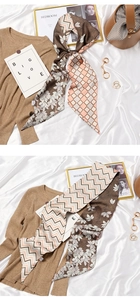 Detailed view of a long French style silk scarf with leaf pattern and geometric weave design