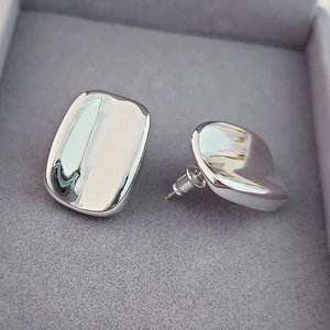 Elegant minimalist silver square stud earrings with high-polished mirror finish surface