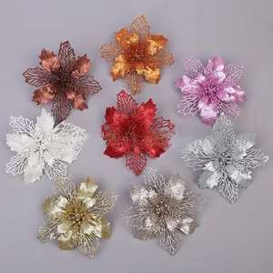 Detailed overhead view of 8 multi-colored glittered hollow poinsettia Christmas flowers
