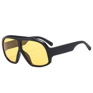 Retro oversized aviator sunglasses with black frame and yellow transparent lenses
