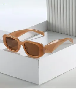 Detail view of stylish square frame sunglasses with wide temples on a geometric platform