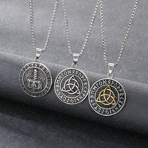 Nordic Mjolnir and Celtic knot necklaces with runic engravings on dark background