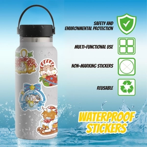 Waterproof Christmas cow stickers on a water bottle showing reuse and durable PVC material