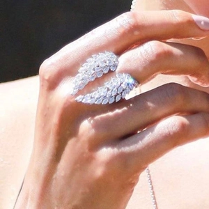 Women's sparkling zircon wings open ring in silver finish worn on the index finger