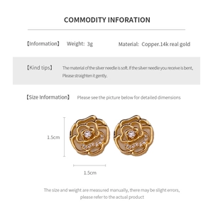 Detail of camellia earrings in 14k gold plated copper with silver needle and diamonds