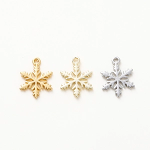Three 18K gold-plated snowflake pendants in gold, champagne gold, and silver finishes